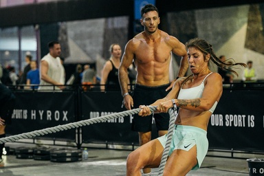 Two athletes showing their physiques